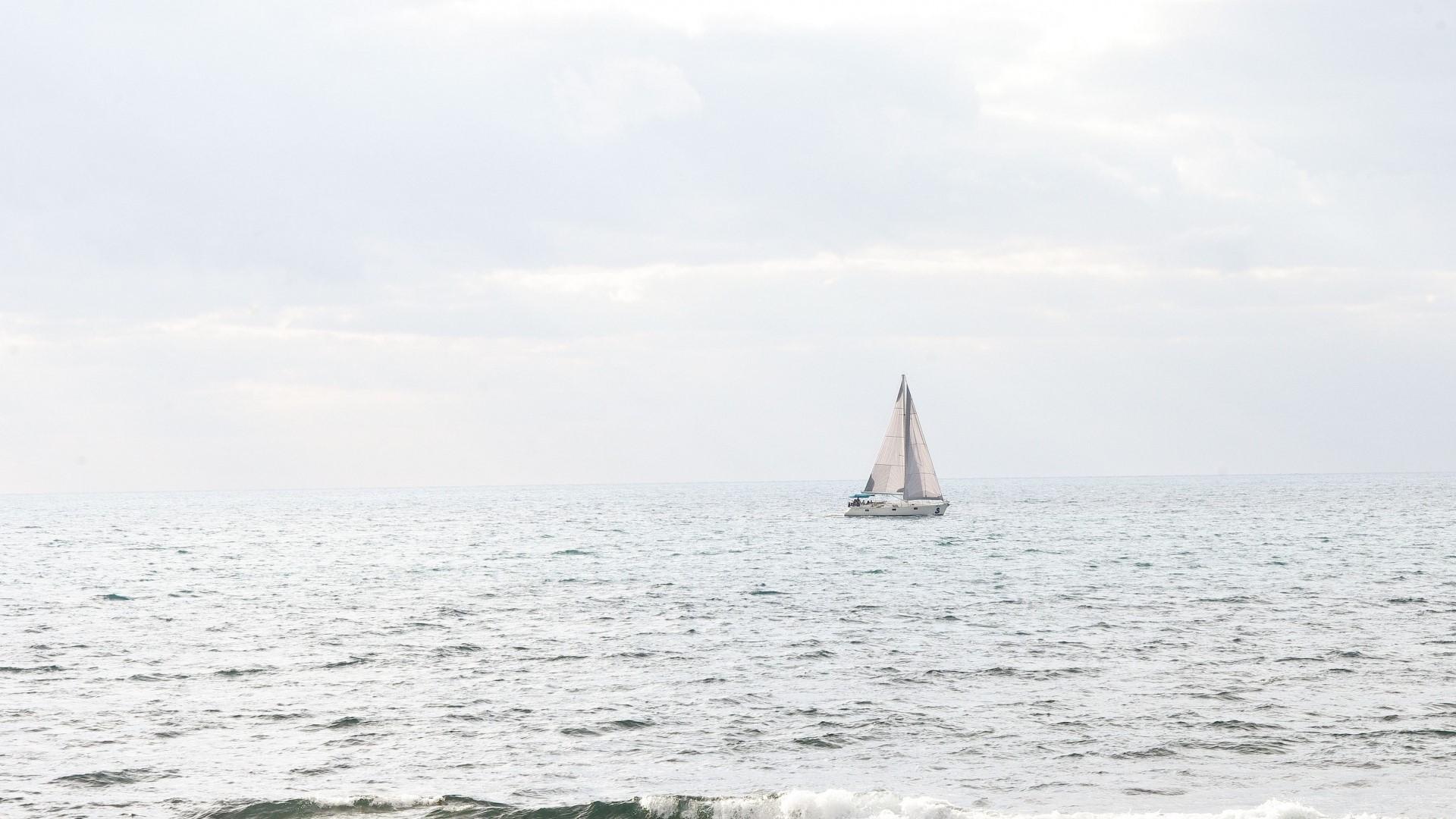 white sailing boat
